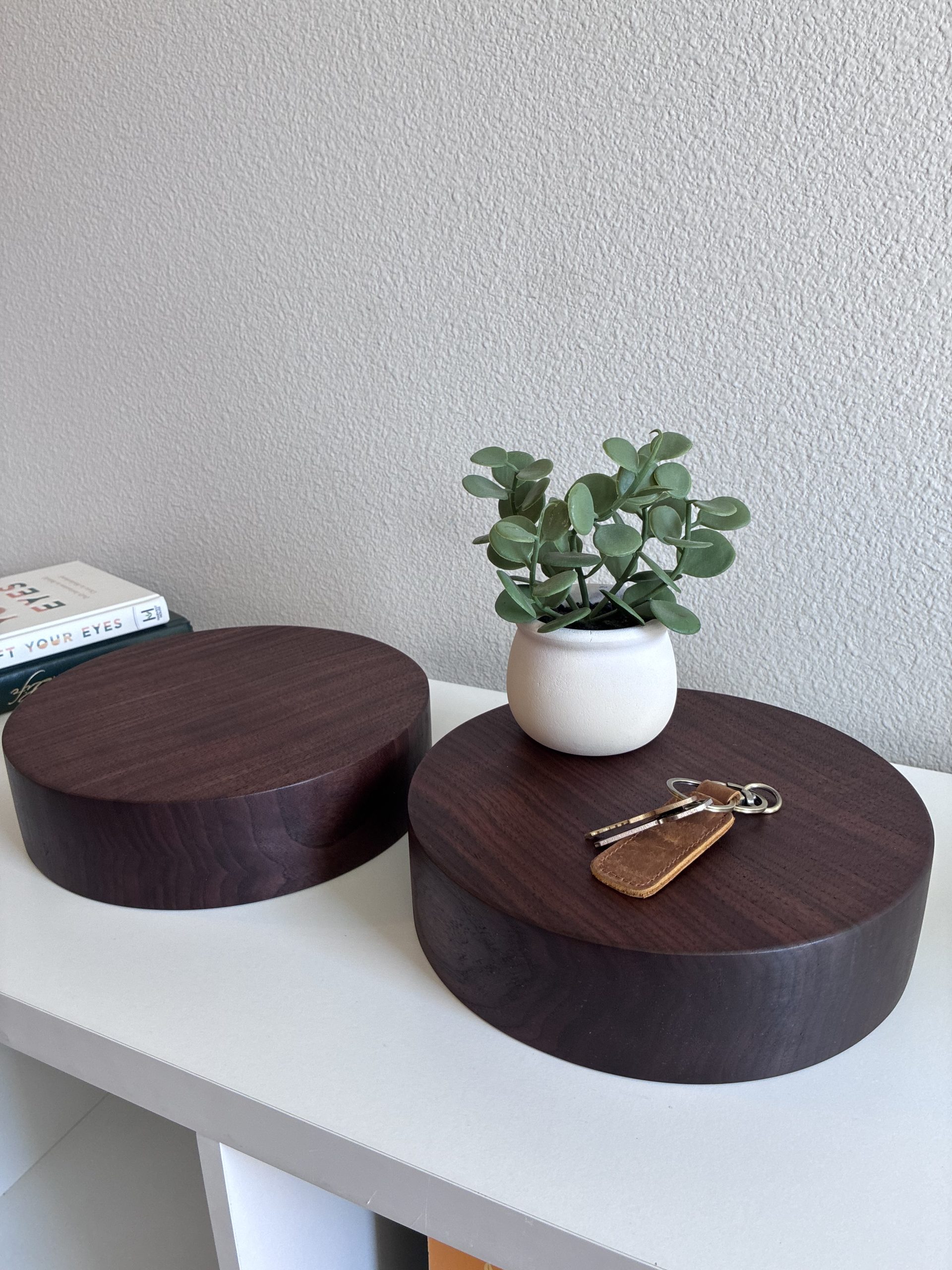 Oregon Black Walnut risers with plant and keys on white table